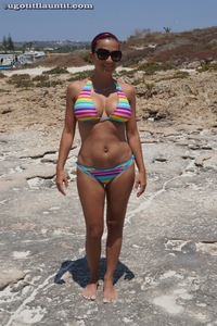 Tina pops out of striped bikini