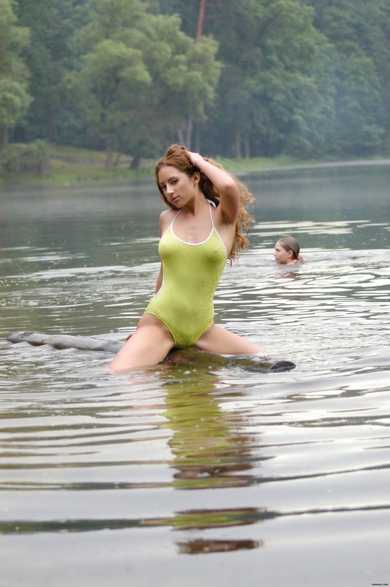 Gioconda pulls down swimsuit