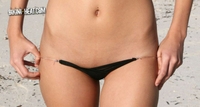 Brunette in sexy black bikini