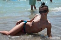 Sara topless on the beach