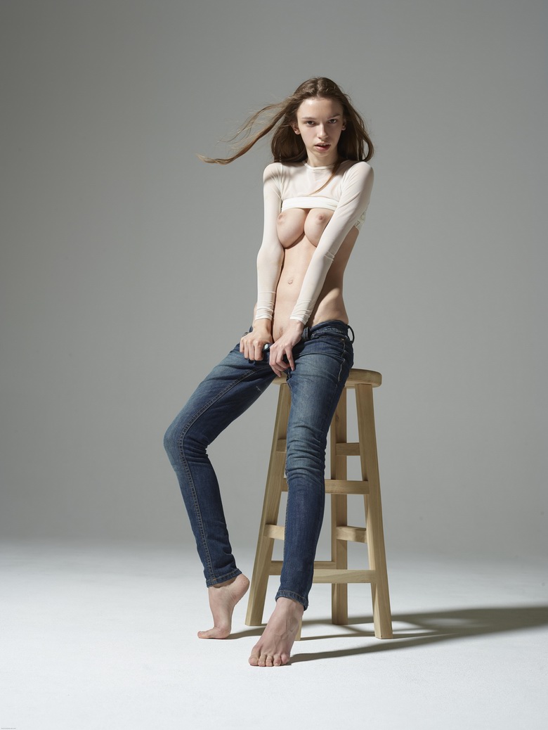 Aya Beshen pulls down jeans