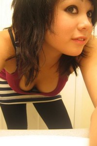 Asian teen tramp posing